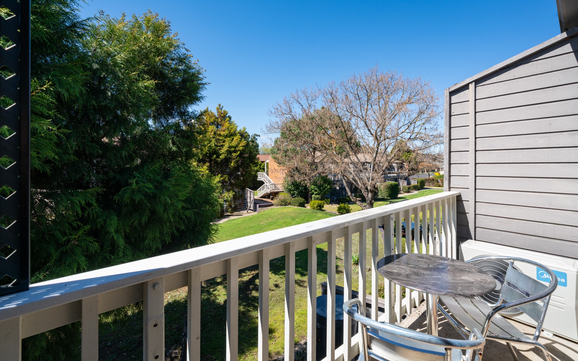 Balcony shot over bbq area upstairs rooms bathurst apartments